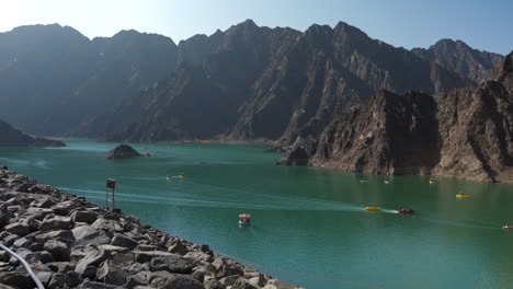 Cinematic-view-of-the-Hatta-Dam-lake-with-boats