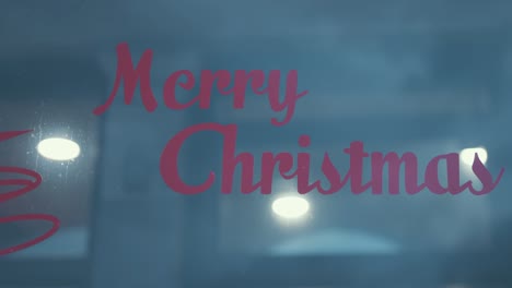 Merry-Christmas-decal-stuck-on-shop-front-glass