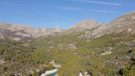 Aerial-view-of-the-mountains-and-the-Guadalest-reservoir-in-Alicante,-Spain