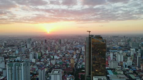 Skyscraper-Construction-Sites-In-Phnom-Penh-during-beautiful-sunset-in-background