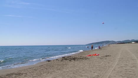 Ada-Bojana-sand-beach-with-some-people-and-kitesurfing
