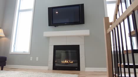 modern-living-room-with-nice-fireplace-and-tv-over-mantle-slider-style-real-estate