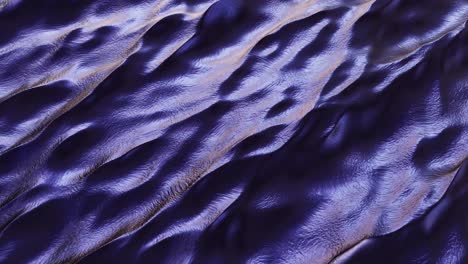 Fantasy-colored-purple-rolling-metal-mercury-liquid-ocean-waves---endless-background-seamless-looping