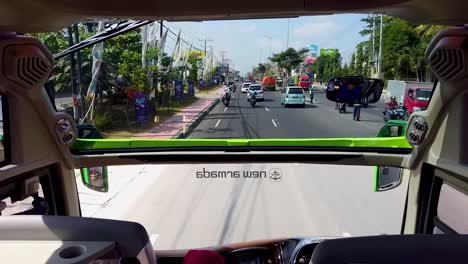 Ride-inside-double-glass-bus,-modern-tourist-coach-on-city-street-of-Magelang