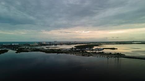 Aerial-sunrise-hyperlapse-at-river-with-ocean-in-the-back,-Daytona-Beach,-Florida