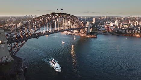 AERIAL-SLOW-MOTION-60FPS,-rush-hour-traffic-crossing-Sydney-Harbour-Bridge