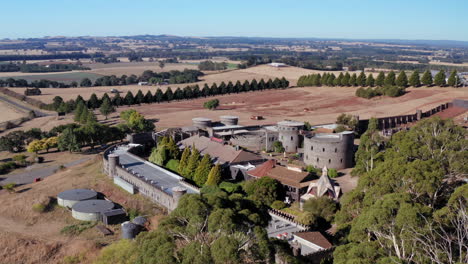 Aerial-view-around-the-Kryal-Castle,-sunny-day,-in-Australia---circling,-drone-shot