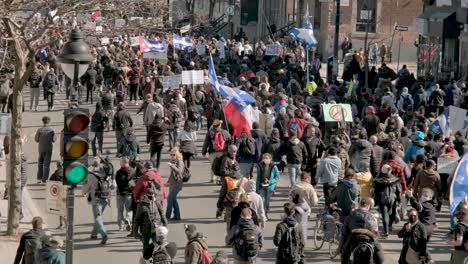 Quebec-flags-in-the-middle-of-a-marching-protest-against-the-Covid-19-measures,-in-Montreal,-Quebec