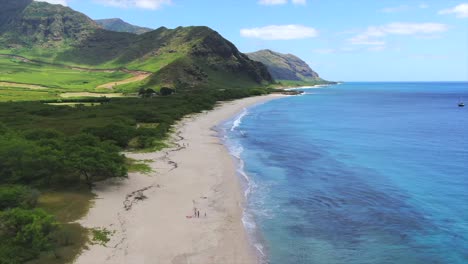 Drone-shot-of-a-secluded-white-sandy-beach-in-Hawaii
