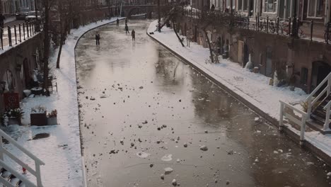 People-Ice-Skating-On-Frozen-Canal-In-Utrecht,-Netherlands