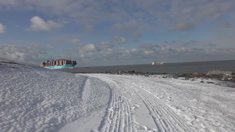 Maersk-Cargo-Ship-Loaded-With-Containers-Sailing-In-The-North-Sea-In-Rotterdam,-Netherlands-On-A-Sunny-Winter-Day