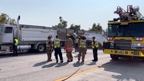 Firefighters-working-truck-crash-scene-on-closed-freeway