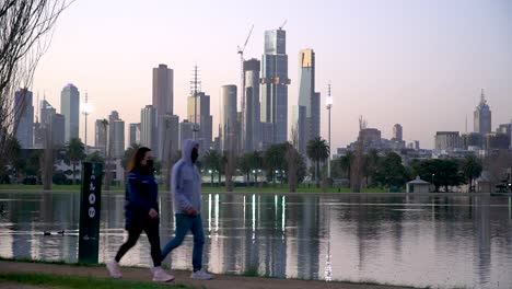Walking-and-exercising-at-sunset-during-the-coronavirus-lockdown-in-Melbourne,-Australia
