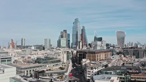 Slow-drone-shot-towards-Bank-and-city-of-London-skyscrapers-over-queen-Victoria-street-mansion-house