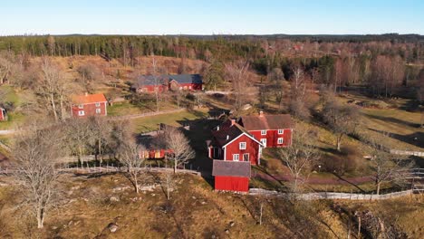 Aerial-Shot-Of-Historic-Settlement-With-Farm-Houses-At-Asens-By-Culture-Reserve,-Sweden