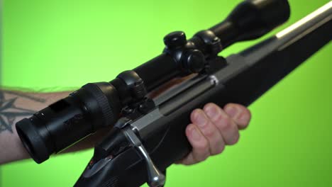 Reloading-rifle-by-pulling-back-endpiece-and-putting-new-cartridge-into-chamber---24fps-green-screen-chroma-key