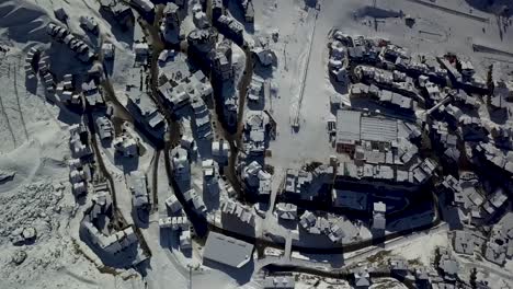 Bird's-eye-view-of-Val-Thorens-europe's-highest-ski-resort-in-the-French-Alps---Aerial-top-fly-over-view