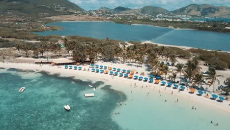 4K-Aerial-Drone-View-of-Beach-and-Palm-Trees-in-Beautiful-Tropical-Location-St-Maarten-Le-Galion-Beach