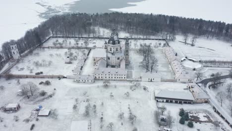 AERIAL:-Tilt-Down-View-of-Pažaislis-Monastery-in-Winter-on-Early-Morning