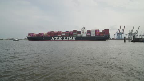 Boxship-NYK-Line-Passes-Through-Harbor-Of-Hamburg,-Germany