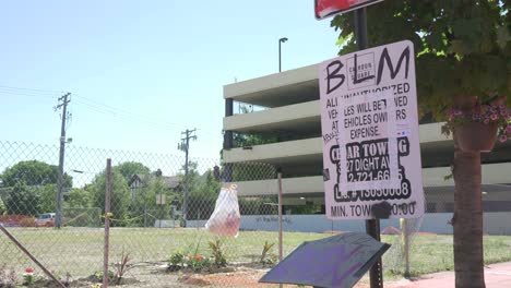 blm-black-lives-matter-written-on-tow-warning-sign-minneapolis-usa-america-slow-motion