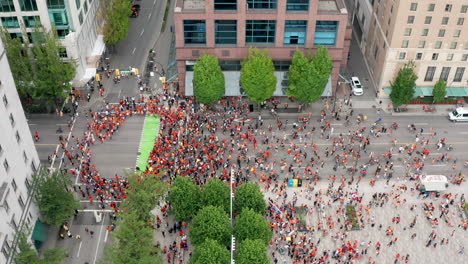 Native-People-Block-West-Georgia-Street-at-a-Cancel-Canada-Day-Protest-in-Vancouver-BC-Canada,-Tilt-Up-Sinking-Drone-view-in-UHD