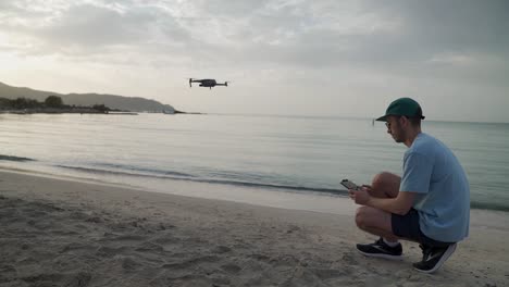Man-initiating-drone-take-off-at-the-beach