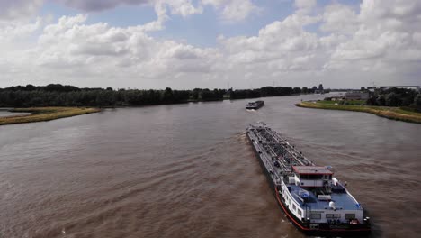 Aerial-Flying-Over-Stern-Side-Of-Curacao-Inland-Tanker-On-River-Noord