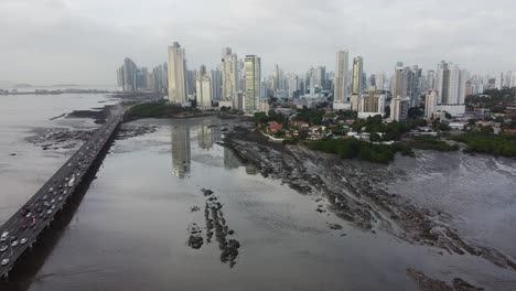Pan-American-Highway-in-Panama-City-crosses-tidal-mud-flat,-overcast