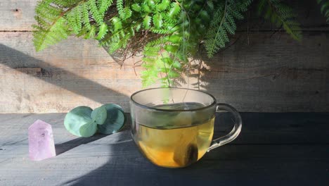side-view-making-nature-inspired-clear-glass-mug-of-tea-with-healing-vibes