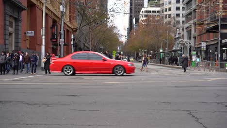 Footage-of-Melbourne-Australia-Iconic-Southern-Cross-Station-Junction-traffics-view-with-trams,-cars-and-pedestrians---bottom-view-showcasing-Melbourne-lifestyle