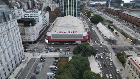 Aerial-flyover-Luna-Park-Stadium-in-Buenos-Aires-during-driving-cars-on-road