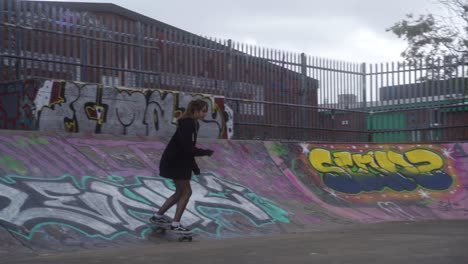 Slow-mo-of-teenager-skateboarding-in-skate-park-in-Sheffield,-England