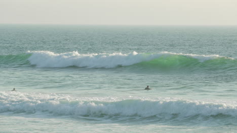 Surfers-waiting-on-the-perfect-wave--Figueira-da-Foz,-Portugal--Wide