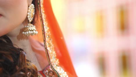 Asian-Bride-Showing-Off-Her-Earrings-With-Bokeh-Background