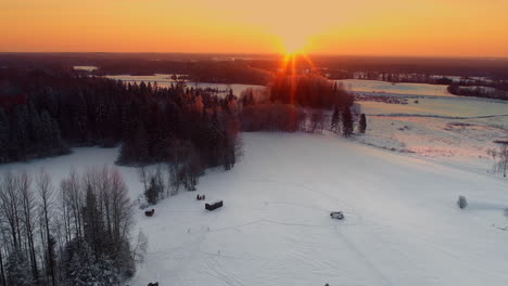 Aerial-view-of-Winter-landscape-at-sunset-with-smal