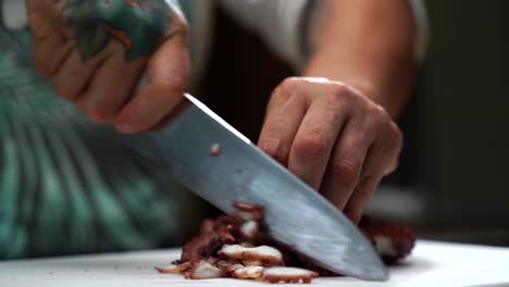 Latin-Chef-cutting-octopus-tentacles-Chopping-detail-shot