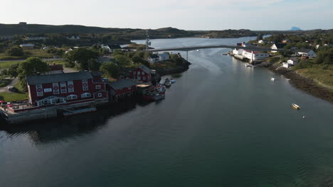 Coastal-Village-And-Road-Bridge-Connecting-Islands-In-Herøy,-Norway---aerial-drone-shot