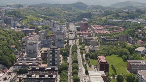 Cityscape-and-street-traffic-of-San-Sebastian-city,-aerial-drone-view