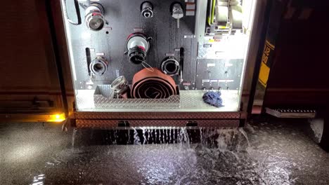Water-leaks-off-of-a-firetruck-compartment-and-falls-on-the-road