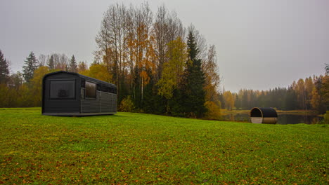 Autumn-cabin-and-barrel-sauna-during-october-autumnal-night-to-day-timelapse
