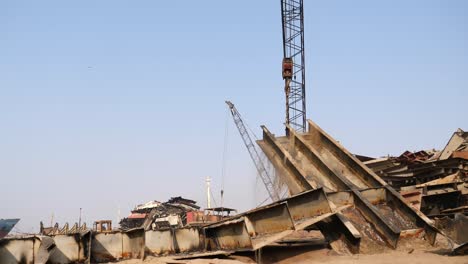 Crane-Lifting-Large-Piece-Of-Metal-At-Gadani-Ship-Breaking-Yard