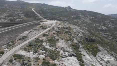 Drone-pushes-over-a-road-towards--Lagoa-Comprida