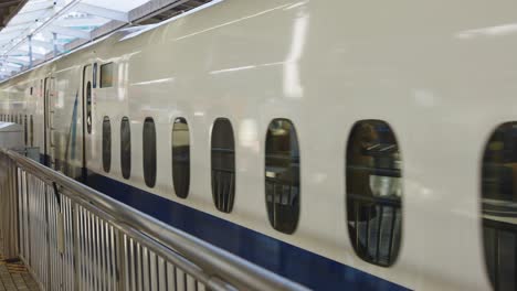 Japanese-High-Speed-Railway,-Shinkansen-Departing-From-Platform