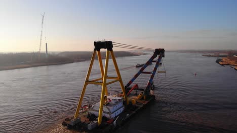 Aerial-Of-Hebo-Lift-Nine-Floating-Crane-Moving-Towards-Horizon-On-Oude-Maas