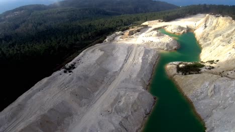 Aerial-View-Of-Green-Toxic-Lake-At-Monte-Neme-Abandoned-Mine