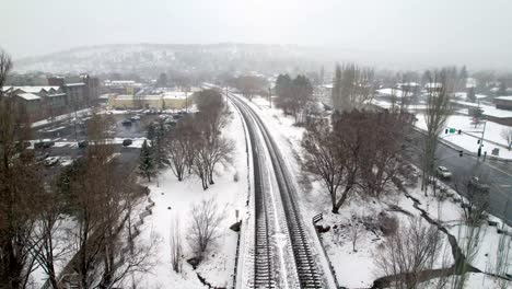 Snow-along-train-tracks-outside-Flagstaff-Arizona-Train-Depot-Aerial