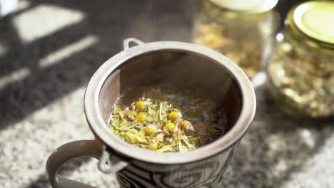 Preparing-hot-chamomile-and-boldo-tea