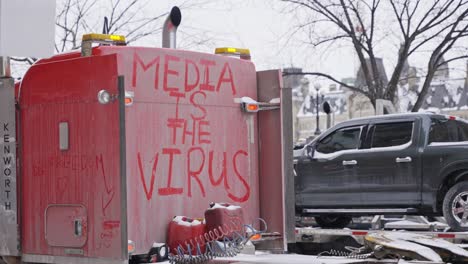 Truck-in-Downtown-Ottawa-Ontario-Canada-With-Media-Is-the-Virus-Trucker-Protest-Freedom-Convoy-2022-COVID-19-Anti-Vax-Anti-Mask-Mandates-Winter