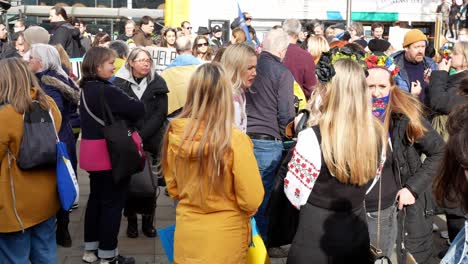 Group-of-people-at-Ukraine-anti-war-protest-supporters-on-Manchester-city-street